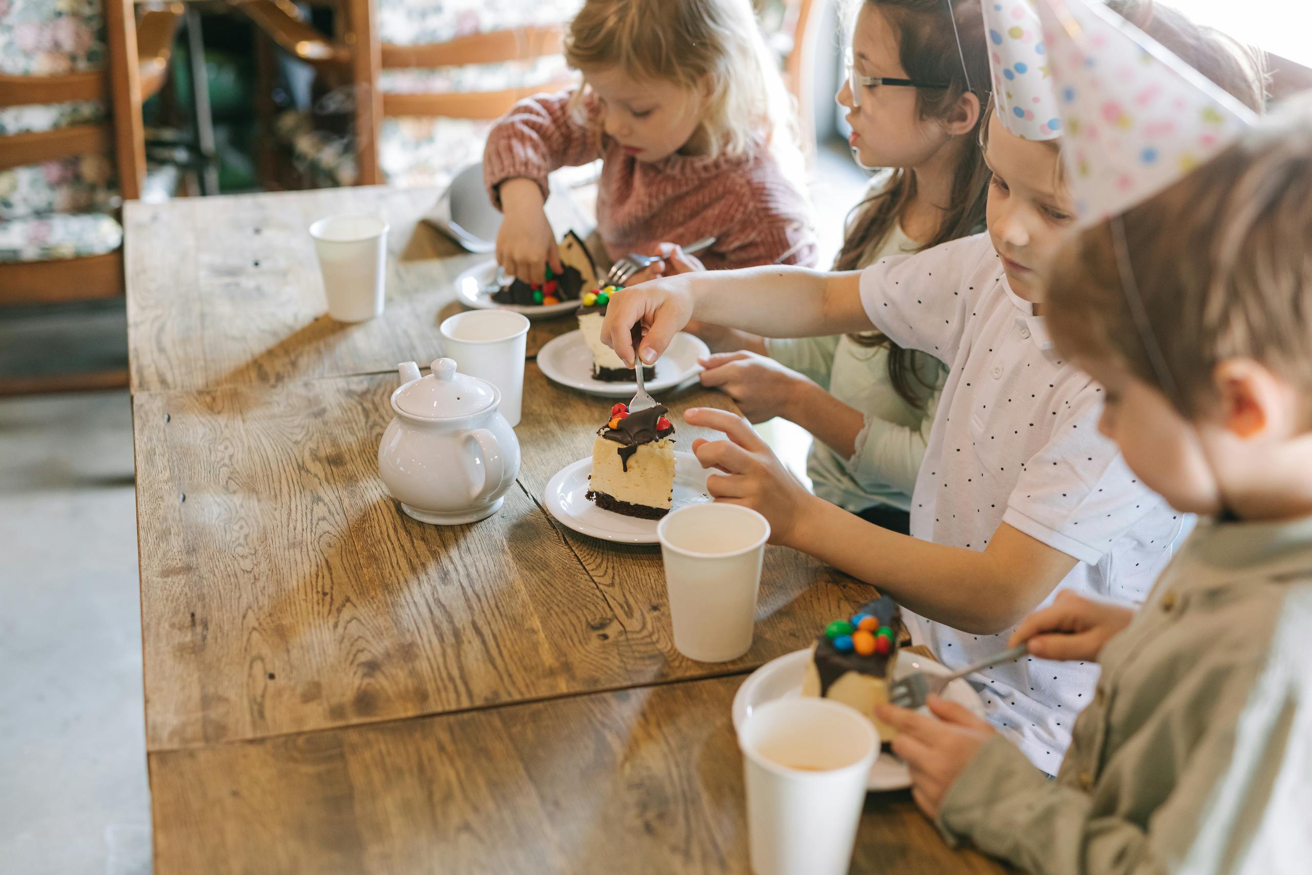 Group of Kids Eating Cake on the Table Social skills cooperative play