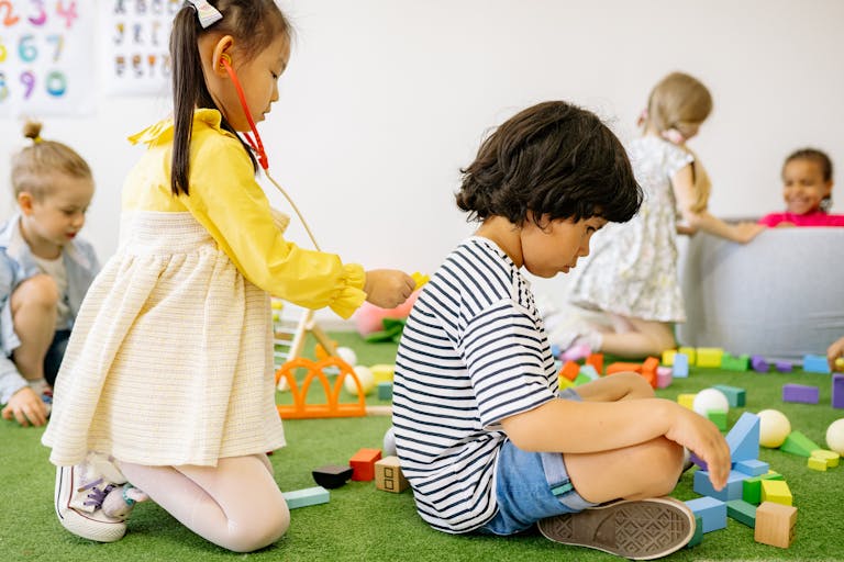 Joyful children engaged in playtime at a cheerful kindergarten setting.